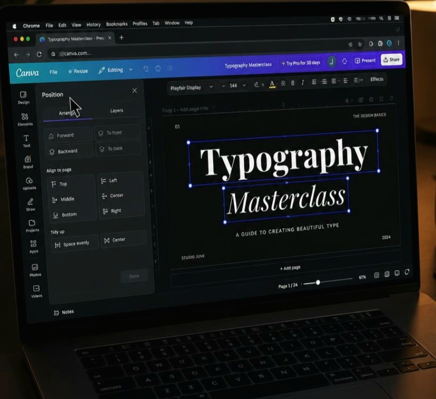 A first-person POV photograph of a content creator adjusting text layer positioning inside Canva using a Google Chrome window on a laptop screen at a desk
